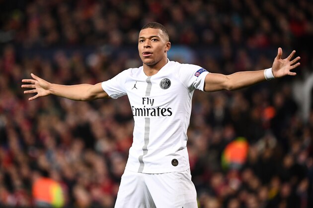 Paris Saint-Germain's French striker Kylian Mbappe celebrates scoring his team's second goal during the first leg of the UEFA Champions League round of 16 football match between Manchester United and Paris Saint-Germain (PSG) at Old Trafford in Manchester, north-west England on February 12, 2019. (Photo by FRANCK FIFE / AFP)        (Photo credit should read FRANCK FIFE/AFP/Getty Images)