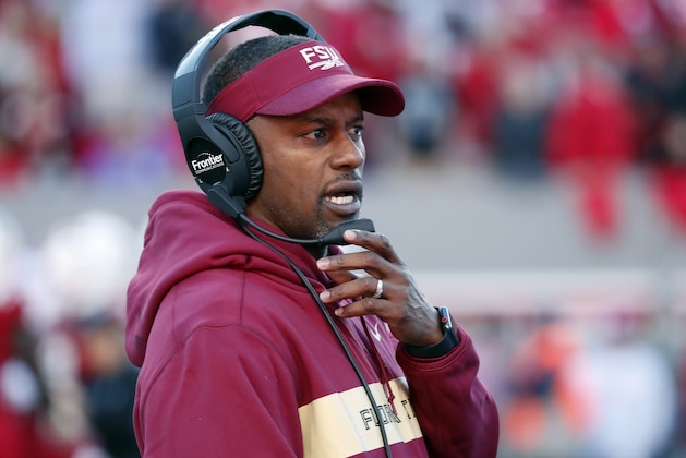 FILE - In this Saturday, Nov. 3, 2018 file photo, Florida State head coach Willie Taggart confers on his headset during the first half of an NCAA college football game against North Carolina State in Raleigh, N.C. Florida State is battling recent history as it looks to extend one of its most cherished streaks. The Seminoles (4-6, 2-5 Atlantic Coast Conference) must knock off No. 22 Boston College (7-3, 4-2) on Saturday and then No. 15 Florida (7-3) to extend their bowl streak, which dates to 1982. While Florida State has dug quite the hole for itself, the roadblocks ahead are daunting _ the Seminoles are 0-7 against ranked teams since the start of the 2017 season. (AP Photo/Chris Seward, File)