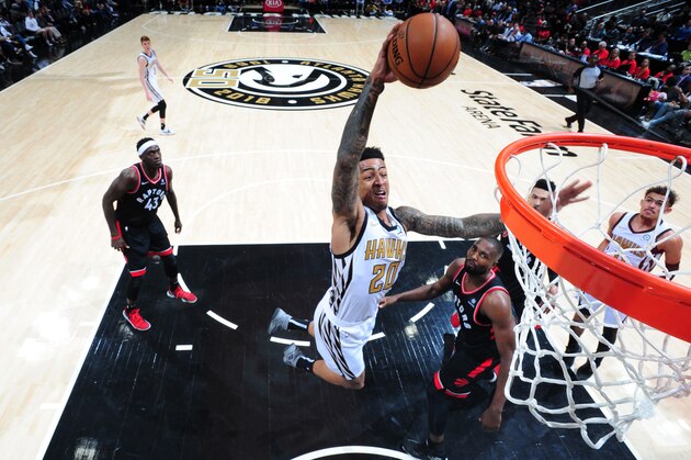 ATLANTA, GA - FEBRUARY 7: John Collins #20 of the Atlanta Hawks goes up for dunk against the Toronto Raptors on February 7, 2019 at State Farm Arena in Atlanta, Georgia.  NOTE TO USER: User expressly acknowledges and agrees that, by downloading and/or using this Photograph, user is consenting to the terms and conditions of the Getty Images License Agreement. Mandatory Copyright Notice: Copyright 2019 NBAE (Photo by Scott Cunningham/NBAE via Getty Images)