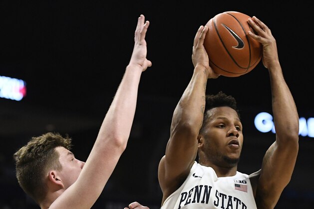 Penn State forward Lamar Stevens (11) shoots over Michigan guard Zavier Simpson (3) during the first half of an NCAA college basketball game, Tuesday, Feb. 12, 2019, in State College, Pa. (AP Photo/John Beale)