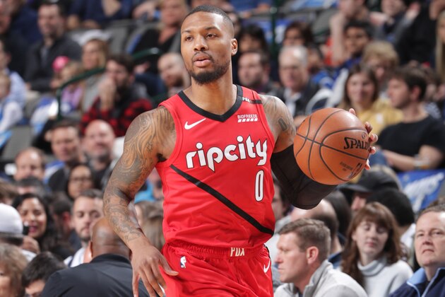 DALLAS, TX - FEBRUARY 10: Damian Lillard #0 of the Portland Trail Blazers dribbles up court against the Dallas Mavericks on February 10, 2019 at the American Airlines Center in Dallas, Texas. NOTE TO USER: User expressly acknowledges and agrees that, by downloading and or using this photograph, User is consenting to the terms and conditions of the Getty Images License Agreement. Mandatory Copyright Notice: Copyright 2019 NBAE (Photo by Glenn James/NBAE via Getty Images)