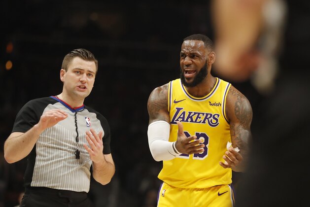 Los Angeles Lakers forward LeBron James (23) argues with an official during the first half of an NBA basketball game against the Atlanta Hawks Tuesday, Feb. 12, 2019, in Atlanta. (AP Photo/John Bazemore)