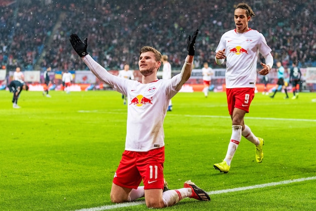Leipzig's German forward Timo Werner (L) celebrates scoring the third goal with his teammate Leipzig's Danish forward Yussuf Poulsen during the German first division Bundesliga football match between RB Leipzig and FSV Mainz in Leipzig, eastern Germany on December 16, 2018. (Photo by ROBERT MICHAEL / AFP) / DFL REGULATIONS PROHIBIT ANY USE OF PHOTOGRAPHS AS IMAGE SEQUENCES AND/OR QUASI-VIDEO        (Photo credit should read ROBERT MICHAEL/AFP/Getty Images)