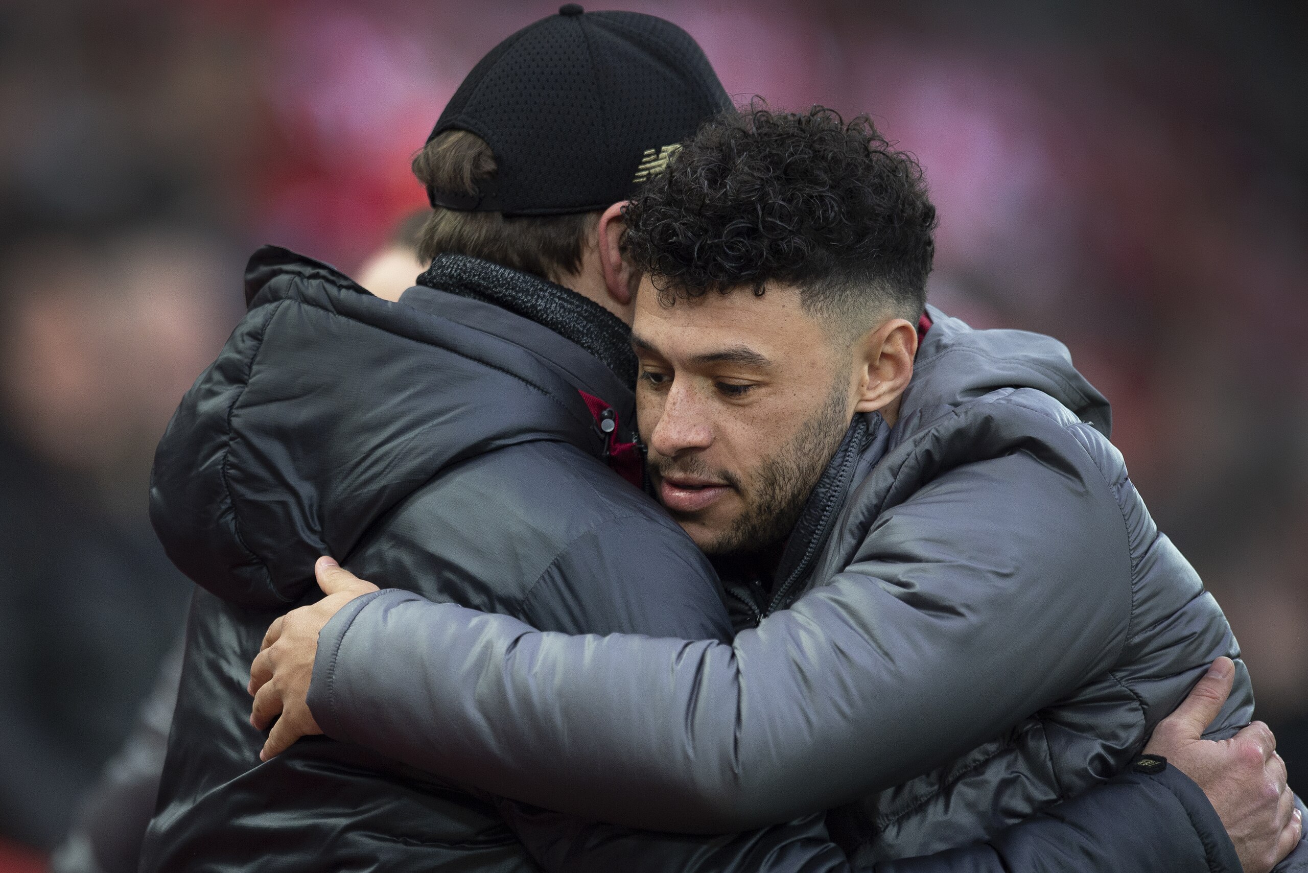 LIVERPOOL, ENGLAND - JANUARY 19: Alex Oxlade-Chamberlain of Liverpool greets manager Jurgen Klopp before the Premier League match between Liverpool FC and Crystal Palace at Anfield on January 19, 2019 in Liverpool, United Kingdom. (Photo by Visionhaus/Getty Images)