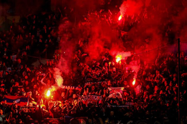 MANCHESTER, ENGLAND - FEBRUARY 12: Fans of Paris Saint Germain / PSG let off flares during the UEFA Champions League Round of 16 First Leg match between Manchester United and Paris Saint-Germain at Old Trafford on February 12, 2019 in Manchester, England. (Photo by Robbie Jay Barratt - AMA/Getty Images)