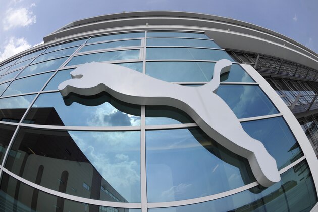 FILE - In this April 20, 2010 file photo the logo of the German sporting goods producer Puma is pictured on a building at the headquarters in Herzogenaurach, southern Germany. Puma said Thursday, July 29, 2010 that its net profit for April-June rose to euro 44.8 million (US dollar 58.2 million) from  euro 38.5 million. (AP Photo/dapd, Uwe Lein, File)