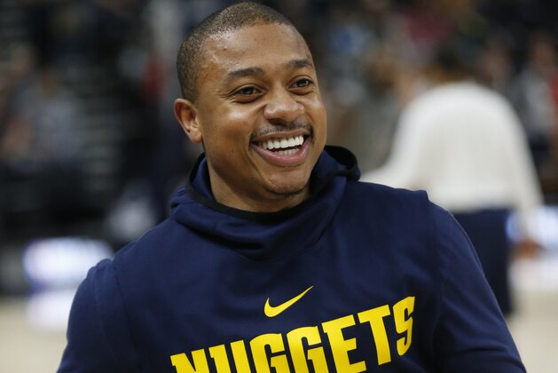 Denver Nuggets guard Isaiah Thomas (0) workouts before the start of their NBA basketball game against the Utah Jazz Wednesday, Jan. 23, 2019, in Salt Lake City. (AP Photo/Rick Bowmer)