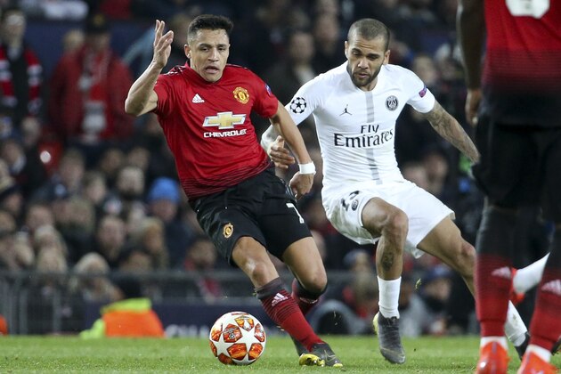 MANCHESTER, ENGLAND - FEBRUARY 12: Alexis Sanchez of Manchester United, Dani Alves of PSG during the UEFA Champions League Round of 16 First Leg match between Manchester United (Man U) and Paris Saint-Germain (PSG) at Old Trafford stadium on February 12, 2019 in Manchester, England. (Photo by Jean Catuffe/Getty Images)