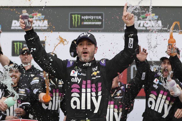 Jimmie Johnson celebrates in Victory Lane after winning the NASCAR Clash auto race at Daytona International Speedway, Sunday, Feb. 10, 2019, in Daytona Beach, Fla. (AP Photo/John Raoux)