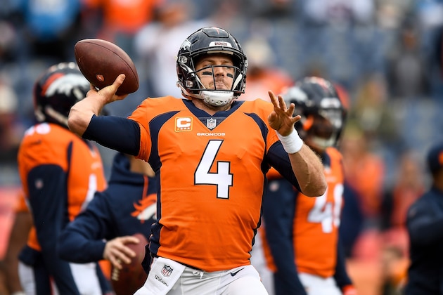 DENVER, CO - DECEMBER 30:  Quarterback Case Keenum #4 of the Denver Broncos throws as he warms up before a game against the Los Angeles Chargers at Broncos Stadium at Mile High on December 30, 2018 in Denver, Colorado. (Photo by Dustin Bradford/Getty Images)