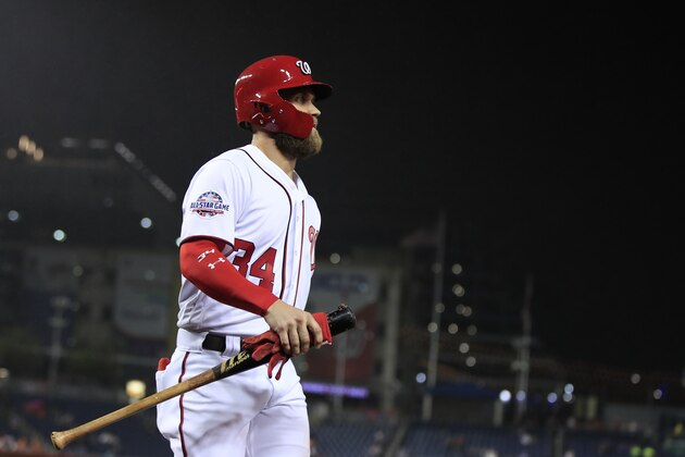 Washington Nationals' Bryce Harper returns to the dugout after scoring during the first inning of a baseball game against the Miami Marlins in Washington, Monday, Sept. 24, 2018. (AP Photo/Manuel Balce Ceneta)