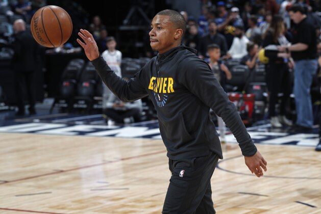 FILE - In this Monday, Fb. 11, 2019, file photo, Denver Nuggets guard Isaiah Thomas warms up before an NBA basketball game against the Miami Heat in Denver. Thomas, who has been sidelined since last season, may take the court Wednesday, Feb. 13, for the first time in a Nuggets uniform. (AP Photo/David Zalubowski, File)
