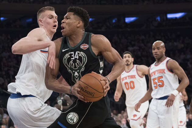 Milwaukee Bucks forward Giannis Antetokounmpo (34) drives to the basket against New York Knicks forward Kristaps Porzingis, left, during the first half of an NBA basketball game Tuesday, Feb. 6, 2018, at Madison Square Garden in New York. (AP Photo/Mary Altaffer)