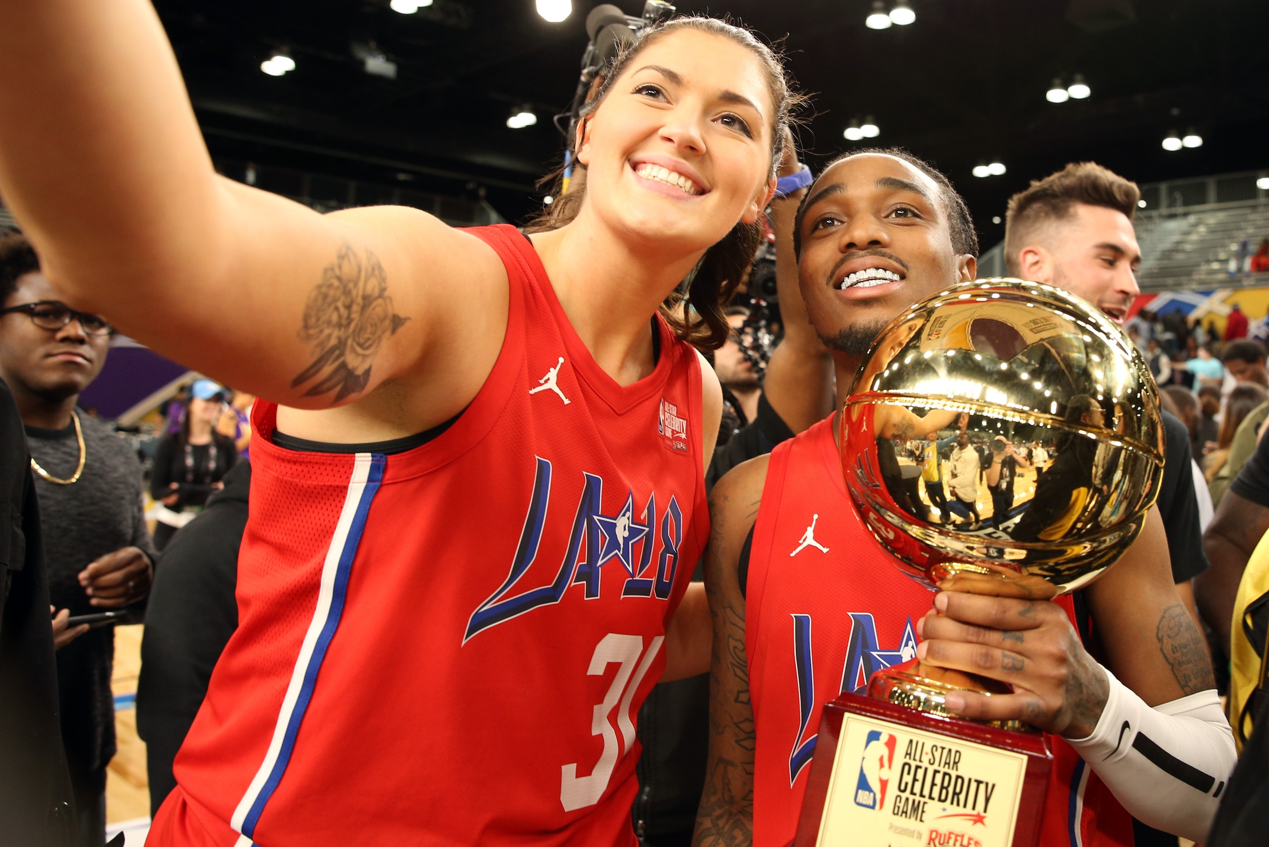 LOS ANGELES, CA - FEBRUARY 16: Stefanie Dolson of the Chicago Sky poses with Actor Quavo after he won the MVP trophy during the 2018 NBA All-Star Game Celebrity Game as part of 2018 NBA All-Star Weekend on February 16, 2018 at Verizon Up Arena in the Los Angeles Convention Center in Los Angeles, California. NOTE TO USER: User expressly acknowledges and agrees that, by downloading and/or using this photograph, user is consenting to the terms and conditions of the Getty Images License Agreement. Mandatory Copyright Notice: Copyright 2018 NBAE (Photo by Chris Marion/NBAE via Getty Images)