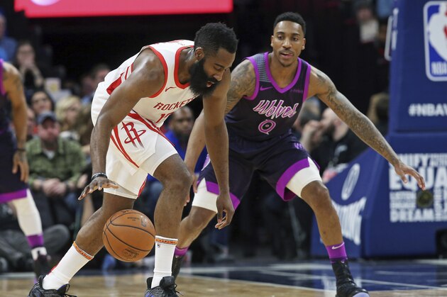 Houston Rockets' James Harden, left, dribbles as Minnesota Timberwolves' Jeff Teague defends in the first half of an NBA basketball game, Wednesday, Feb. 13, 2019, in Minneapolis. (AP Photo/Jim Mone)