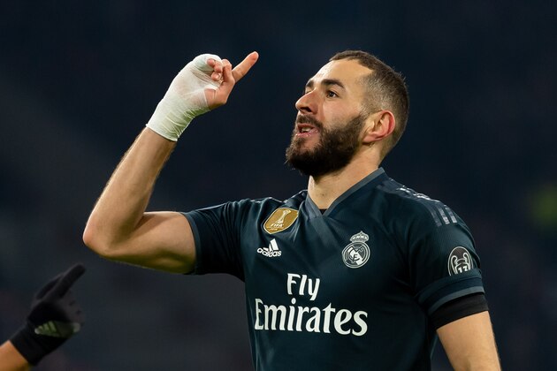 AMSTERDAM, NETHERLANDS - FEBRUARY 13: Karim Benzema of Real Madrid celebrates after scoring his team's first goal during to the UEFA Champions League Round of 16 First Leg match between Ajax and Real Madrid at Johan Cruyff Arena on February 13, 2019 in Amsterdam, Netherlands. (Photo by TF-Images/TF-Images via Getty Images)