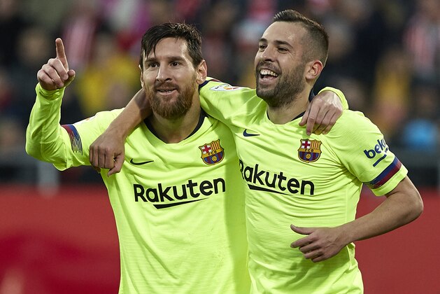 GIRONA, SPAIN - JANUARY 27: Lionel Messi of Barcelona celebrates after scoring his sides second goal with his teammate Jordi Alba during the La Liga match between Girona FC and FC Barcelona at Montilivi Stadium on January 27, 2019 in Girona, Spain. (Photo by Quality Sport Images/Getty Images)