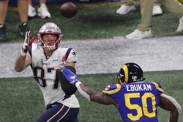 New England Patriots' Rob Gronkowski (87) prepares to make a catch against Los Angeles Rams' Samson Ebukam (50) during the second half of the NFL Super Bowl 53 football game Sunday, Feb. 3, 2019, in Atlanta. (AP Photo/Charlie Riedel)