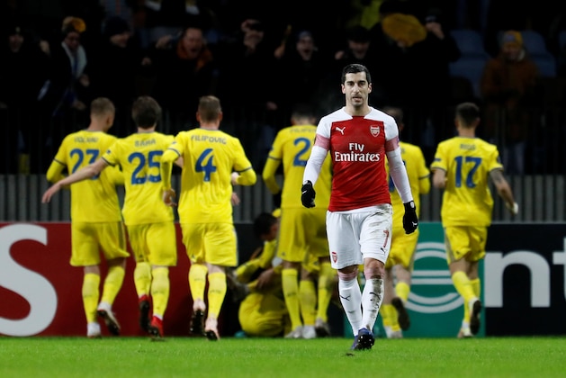 BARYSAW, BELARUS - FEBRUARY 14: Henrikh Mkhitaryan of Arsenal reacts as BATE Borisov players celebrate a goal in background during the UEFA Europa League Round of 32 First Leg match between BATE Borisov and Arsenal at Borisov-Arena on February 14, 2019 in Borisov, Belarus. (Photo by MB Media/Getty Images)