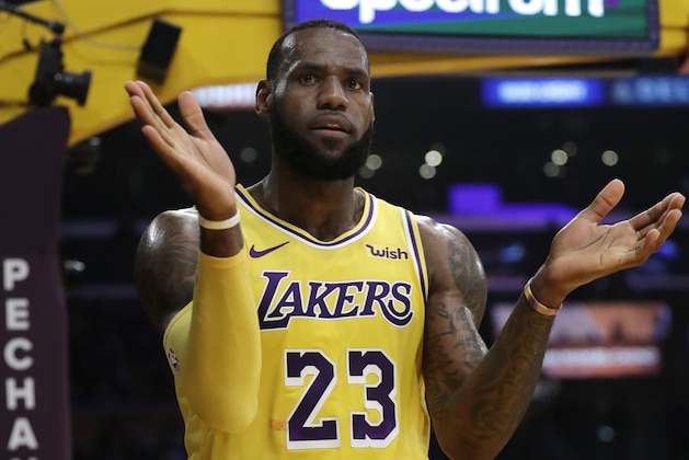 Los Angeles Lakers' LeBron James (23) claps after scoring against the Miami Heat during the first half of an NBA basketball game Monday, Dec. 10, 2018, in Los Angeles. (AP Photo/Marcio Jose Sanchez)
