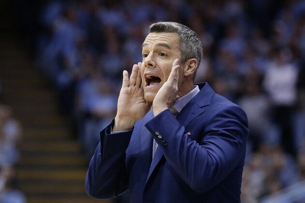 Virginia head coach Tony Bennett directs his players during the first half of an NCAA college basketball game against North Carolina in Chapel Hill, N.C., Monday, Feb. 11, 2019. (AP Photo/Gerry Broome)