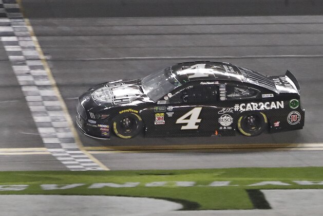 Kevin Harvick crosses the finish line to win the first of two qualifying auto races for the NASCAR Daytona 500 at Daytona International Speedway, Thursday, Feb. 14, 2019, in Daytona Beach, Fla. (AP Photo/John Raoux)
