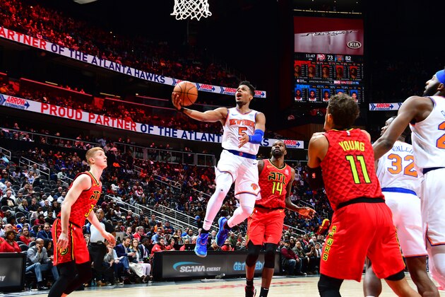 ATLANTA, GA - FEBRUARY 14: Dennis Smith Jr. #5 of the New York Knicks goes up for shot against the Atlanta Hawks on February 14, 2019 at State Farm Arena in Atlanta, Georgia.  NOTE TO USER: User expressly acknowledges and agrees that, by downloading and/or using this Photograph, user is consenting to the terms and conditions of the Getty Images License Agreement. Mandatory Copyright Notice: Copyright 2019 NBAE (Photo by Scott Cunningham/NBAE via Getty Images)