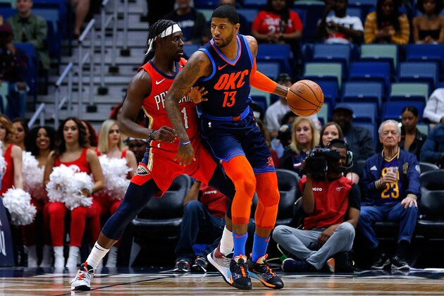 NEW ORLEANS, LOUISIANA - FEBRUARY 14: Paul George #13 of the Oklahoma City Thunder drives against Jrue Holiday #11 of the New Orleans Pelicans during the first half at the Smoothie King Center on February 14, 2019 in New Orleans, Louisiana. NOTE TO USER: User expressly acknowledges and agrees that, by downloading and or using this photograph, User is consenting to the terms and conditions of the Getty Images License Agreement. (Photo by Jonathan Bachman/Getty Images)