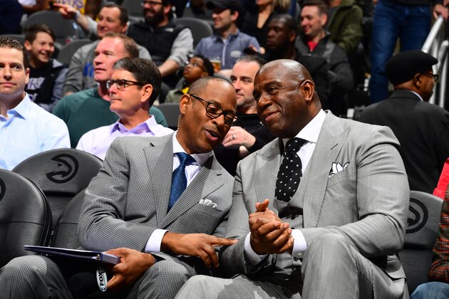 ATLANTA, GA - FEBRUARY 12: Andre Aldridge, and Magic Johnson are seen talking together during the game between the Atlanta Hawks and the Los Angeles Lakers on February 12, 2019 at State Farm Arena in Atlanta, Georgia.  NOTE TO USER: User expressly acknowledges and agrees that, by downloading and/or using this Photograph, user is consenting to the terms and conditions of the Getty Images License Agreement. Mandatory Copyright Notice: Copyright 2019 NBAE (Photo by Scott Cunningham/NBAE via Getty Images)