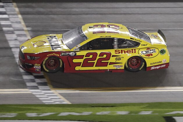 Joey Logano (22) crosses the finish line to win the second of two qualifying auto races for the NASCAR Daytona 500 at Daytona International Speedway, Thursday, Feb. 14, 2019, in Daytona Beach, Fla. (AP Photo/John Raoux)