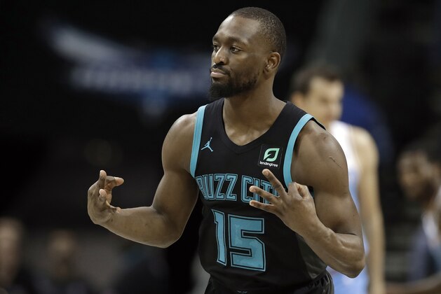 Kemba Walker (15) gestures after making a 3-point basket against the Sacramento Kings during the second half of an NBA basketball game in Charlotte, N.C., Thursday, Jan. 17, 2019. (AP Photo/Chuck Burton)