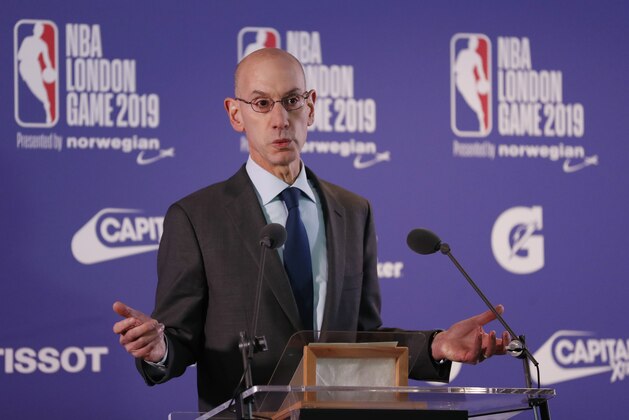 NBA commissioner Adam Silver gestures during a news conference prior to the start of an NBA basketball game between New York Knicks and Washington Wizards at the O2 Arena, in London, Thursday, Jan.17, 2019. (AP Photo/Alastair Grant)
