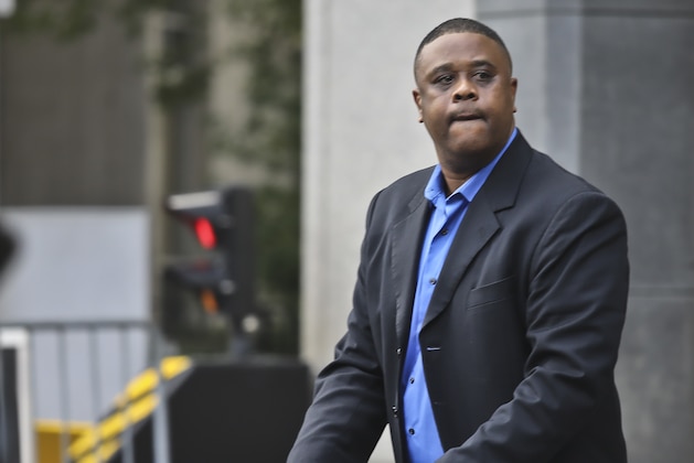 Former amateur basketball league director Merl Code push a stroller as he leaves federal court in New York, Wednesday, Oct. 24, 2018. Code and two other insiders from the high-stakes world of college basketball recruiting were convicted Wednesday in a corruption case that prosecutors said exposed the underbelly of the sport. (AP Photo/Bebeto Matthews)