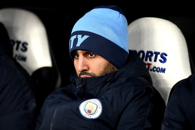 NEWCASTLE UPON TYNE, ENGLAND - JANUARY 29:  Riyad Mahrez of Manchester City looks on from the bench prior to the Premier League match between Newcastle United and Manchester City at St. James Park on January 29, 2019 in Newcastle upon Tyne, United Kingdom.  (Photo by Michael Regan/Getty Images)