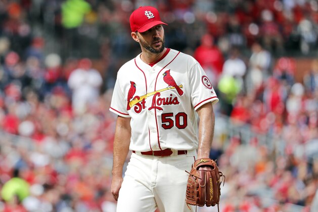 FILE - In this Sept. 22, 2018, file photo, St. Louis Cardinals starting pitcher Adam Wainwright walks off the field after being removed in the seventh inning of a baseball game against the San Francisco Giants in St. Louis. Wainwright’s contract with the Cardinals has been put on hold because it violates the maximum-cut rule, and the pitcher will have to become a free agent before the agreement can be finalized, people familiar with the deal told The Associated Press, Thursday, Oct. 18, 2018. St. Louis announced the agreement with the 37-year-old right-hander on Oct. 11. He was earning $19.5 million annually, and the new deal guarantees less than $15.6 million. (AP Photo/Jeff Roberson, FIle)