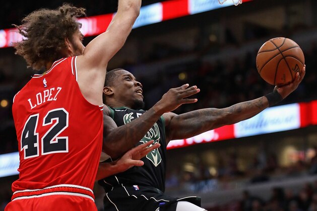 CHICAGO, ILLINOIS - FEBRUARY 11: Eric Bledsoe #6 of the Milwaukee Bucks drives to the basket against Robin Lopez #42 of the Chicago Bulls at the United Center on February 11, 2019 in Chicago, Illinois. The Bucks defeated the Bulls 112-99. NOTE TO USER: User expressly acknowledges and agrees that, by downloading and or using this photograph, User is consenting to the terms and conditions of the Getty Images License Agreement. (Photo by Jonathan Daniel/Getty Images)