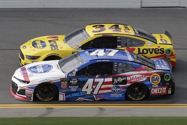 Ryan Preece (47) and Michael McDowell (34) race side-by-side during a practice session for the NASCAR Daytona 500 auto race at Daytona International Speedway, Friday, Feb. 15, 2019, in Daytona Beach, Fla. (AP Photo/John Raoux)