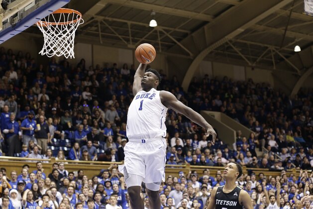 Duke's Zion Williamson (1) drives for a dunk against Stetson during the second half of an NCAA college basketball game in Durham, N.C., Saturday, Dec. 1, 2018. (AP Photo/Gerry Broome)