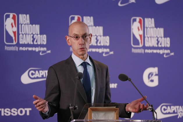 NBA commissioner Adam Silver gestures during a news conference prior to the start of an NBA basketball game between New York Knicks and Washington Wizards at the O2 Arena, in London, Thursday, Jan.17, 2019. (AP Photo/Alastair Grant)