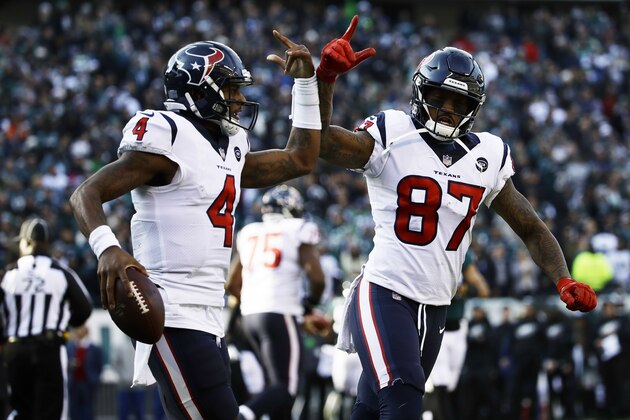 Houston Texans' Deshaun Watson (4) and Demaryius Thomas (87) celebrate after Watson's touchdown during the first half of an NFL football game against the Philadelphia Eagles, Sunday, Dec. 23, 2018, in Philadelphia. (AP Photo/Matt Rourke)