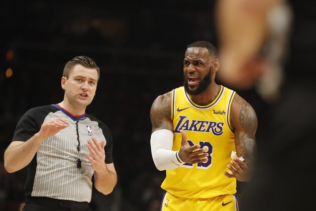 Los Angeles Lakers forward LeBron James (23) argues with an official during the first half of an NBA basketball game against the Atlanta Hawks Tuesday, Feb. 12, 2019, in Atlanta. (AP Photo/John Bazemore)