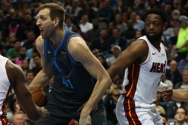 DALLAS, TEXAS - FEBRUARY 13:  Dirk Nowitzki #41 of the Dallas Mavericks dribbles the ball against Dwyane Wade #3 of the Miami Heat at American Airlines Center on February 13, 2019 in Dallas, Texas.  NOTE TO USER: User expressly acknowledges and agrees that, by downloading and or using this photograph, User is consenting to the terms and conditions of the Getty Images License Agreement. (Photo by Ronald Martinez/Getty Images)