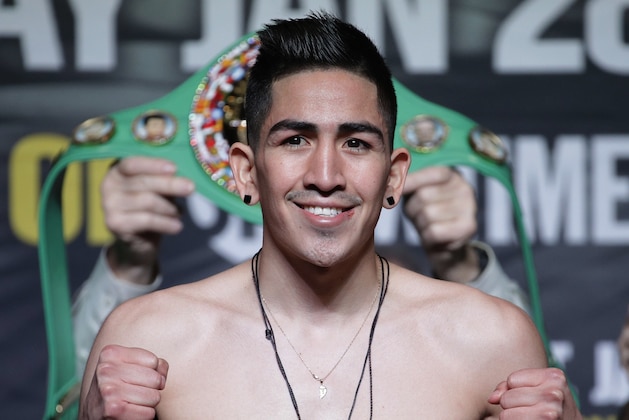 Leo Santa Cruz smiles during a weigh-in Friday, Jan. 27, 2017, in Las Vegas. Santa Cruz is scheduled to fight Carl Frampton, of Northern Ireland, in a featherweight title boxing bout Saturday in Las Vegas. (AP Photo/John Locher)
