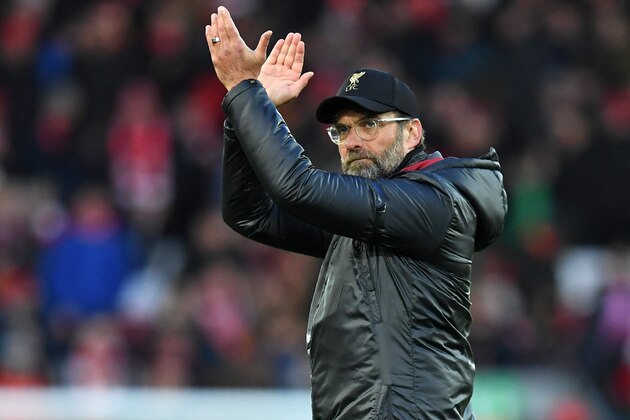 Liverpool's German manager Jurgen Klopp applauds supporters after the English Premier League football match between Liverpool and Bournemouth at Anfield in Liverpool, north west England on February 9, 2019. - Liverpool won the game 3-0. (Photo by Paul ELLIS / AFP) / RESTRICTED TO EDITORIAL USE. No use with unauthorized audio, video, data, fixture lists, club/league logos or 'live' services. Online in-match use limited to 120 images. An additional 40 images may be used in extra time. No video emulation. Social media in-match use limited to 120 images. An additional 40 images may be used in extra time. No use in betting publications, games or single club/league/player publications. /         (Photo credit should read PAUL ELLIS/AFP/Getty Images)