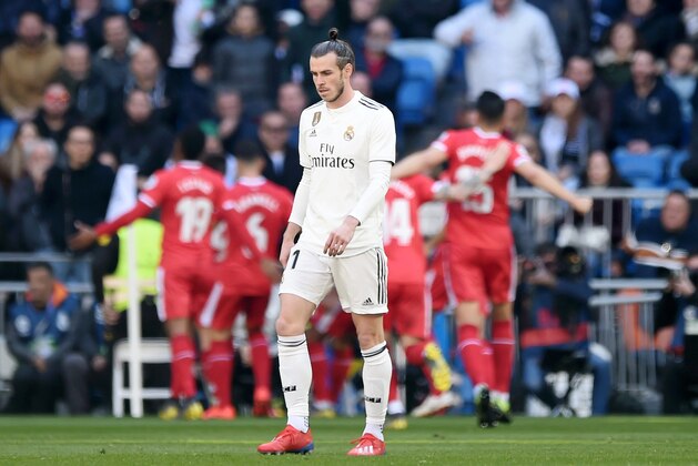 MADRID, SPAIN - FEBRUARY 17: Gareth Bale of Real Madrid reacts after Portu of Girona (not pictured) scores his team's second goal during the La Liga match between Real Madrid CF and Girona FC at Estadio Santiago Bernabeu on February 17, 2019 in Madrid, Spain.  (Photo by Denis Doyle/Getty Images)