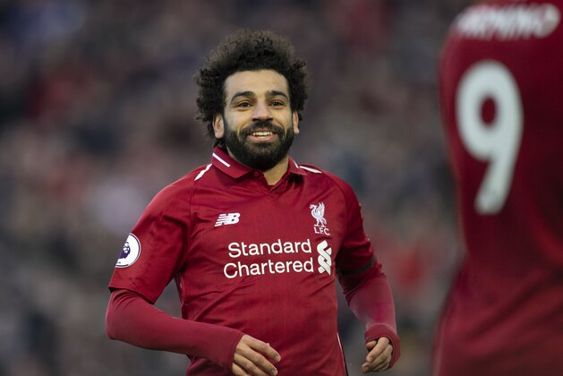 LIVERPOOL, ENGLAND - FEBRUARY 09: Mohamed Salah of Liverpool celebrates scoring the third goal during the Premier League match between Liverpool FC and AFC Bournemouth at Anfield on February 9, 2019 in Liverpool, United Kingdom. (Photo by Visionhaus/Getty Images)