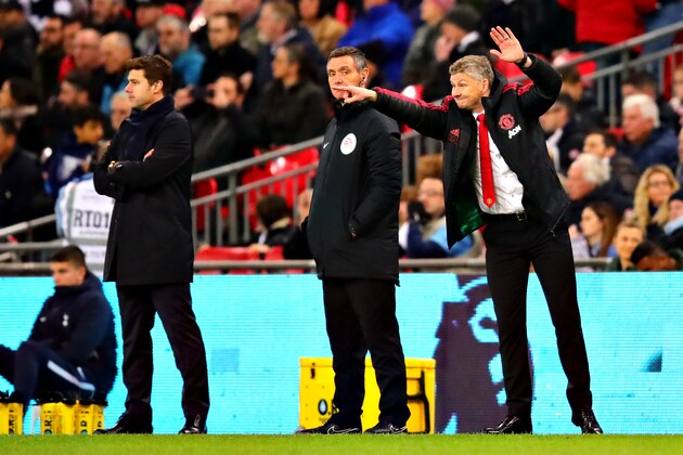 LONDON, ENGLAND - JANUARY 13: Manager of Manchester United Ole Gunnar Solskjaer (R) gestures as Manager of Tottenham Hotspur Mauricio Pochettino, looks on from the sidelines during the Premier League match between Tottenham Hotspur and Manchester United at Wembley Stadium on January 13, 2019 in London, United Kingdom. (Photo by Chris Brunskill/Fantasista/Getty Images)