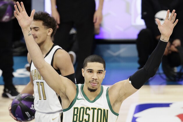 Boston Celtics Jayson Tatum celebrates winning the NBA All-Star skills session basketball contest, Saturday, Feb. 16, 2019, in Charlotte, N.C. (AP Photo/Gerry Broome)