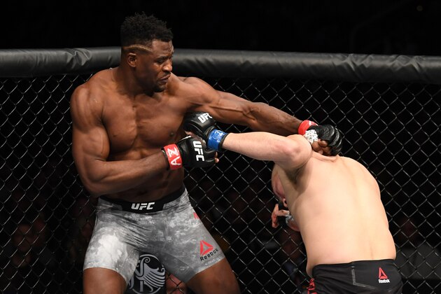 PHOENIX, ARIZONA - FEBRUARY 17:  (L-R) Francis Ngannou of Cameroon punches Cain Velasquez in their heavyweight bout during the UFC Fight Night event at Talking Stick Resort Arena on February 17, 2019 in Phoenix, Arizona. (Photo by Josh Hedges/Zuffa LLC/Zuffa LLC via Getty Images)