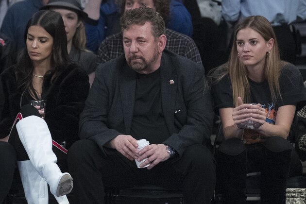 FILE - In this Oct. 20, 2018, file photo, Madison Square Garden chairman James Dolan, center, watches an NBA basketball game between the New York Knicks and the Boston Celtics at Madison Square Garden in New York. It's been a year since Dolan announced his intent to sell the New York Liberty, and the team is still on the market. There have been several potential buyers and a few have gotten close to purchasing the team, but for various reasons all the potential deals fell through. Even without a new owner on the horizon and the Liberty in the same situation as last November, there is no danger of the team ceasing to exist this winter. (AP Photo/Mary Altaffer, File)
